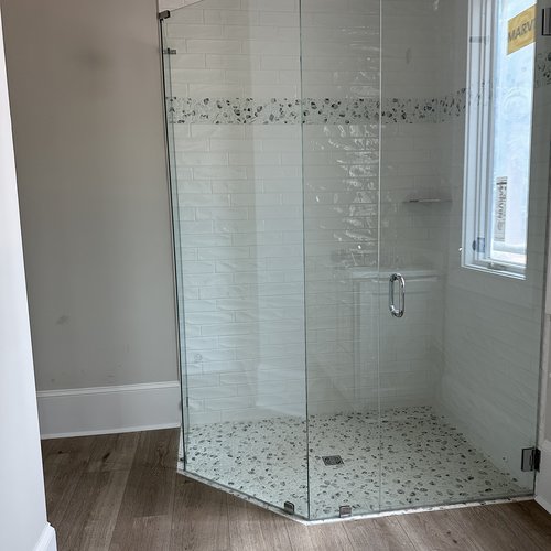 New floors and tiled shower in a bathroom by Marquis Floors in Lilburn, GA