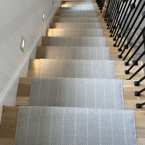 Stair runners in a bright hallway by Marquis Floors in Lilburn, GA