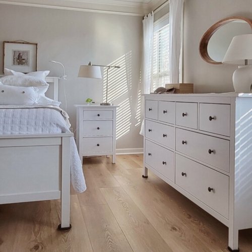 New hardwood flooring in a bright bedroom by Marquis Floors in Lilburn, GA